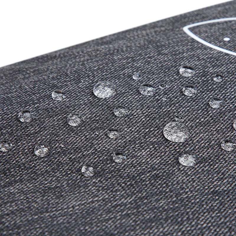 Grand sac de raquettes SANXDI, gros plan sur la toile gris chiné où perlent des gouttes d'eau