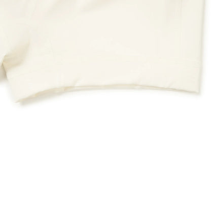 Jupe-short femme Li-Ning LN DRY blanc cassé : détail de l'ourlet du short intégré sous la jupe